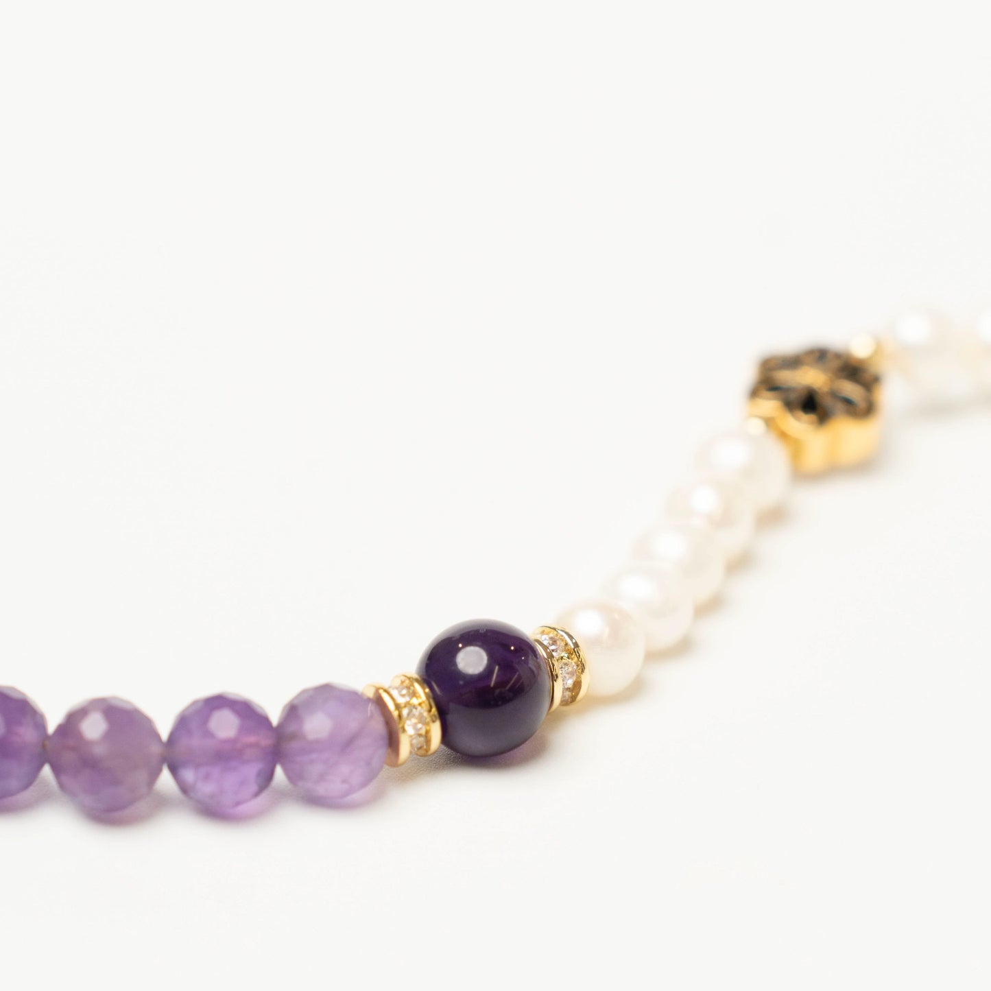 More than a gift: This Mulstio bracelet symbolizes a wish for clarity (Amethyst) and sincerity (Pearl) for someone special born in February.