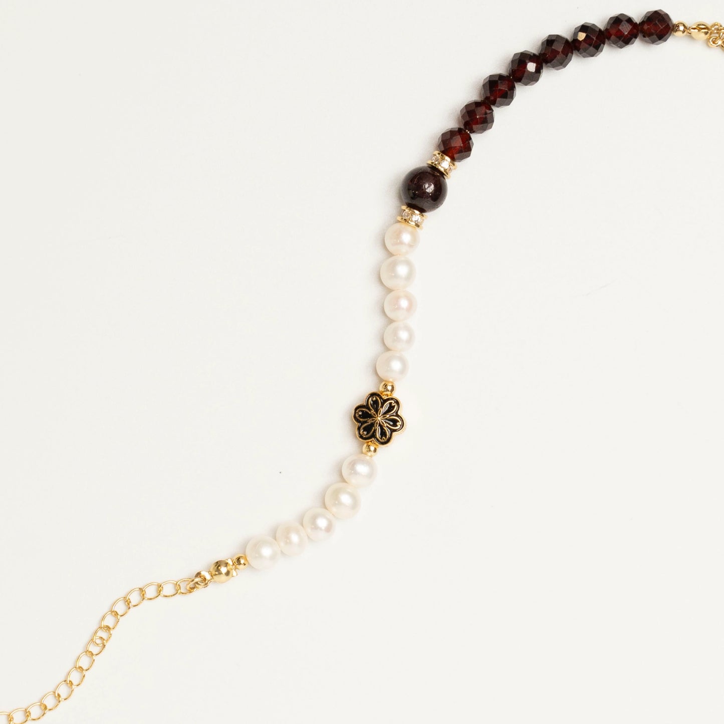 An elegant gift idea: The Mulstio Garnet and Pearl Bracelet, symbolizing a powerful blend of passionate love (garnet) and pure sincerity (pearl).