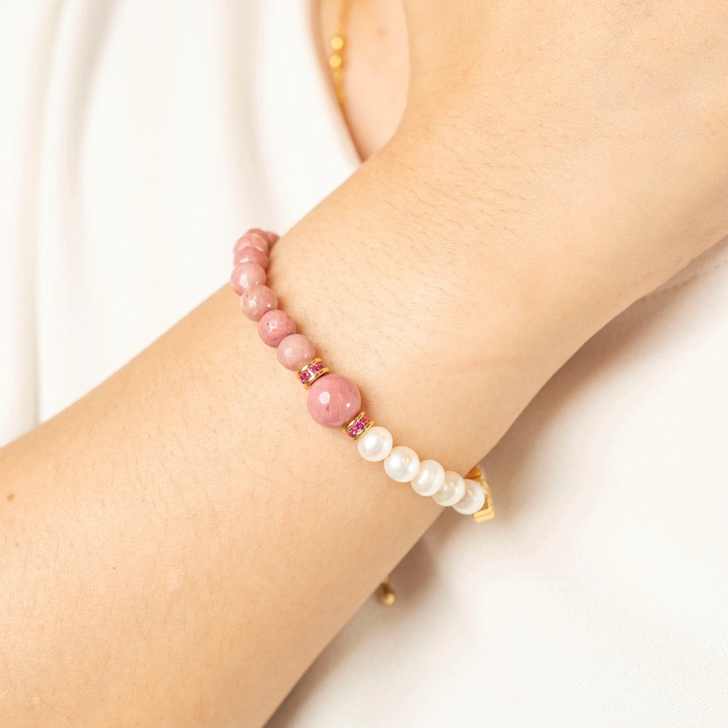 Begin your heart healing journey. Discover the Mulstio July Birthstone Bracelet, a beautiful synergy of Inca Rose's power and Pearl's grace.