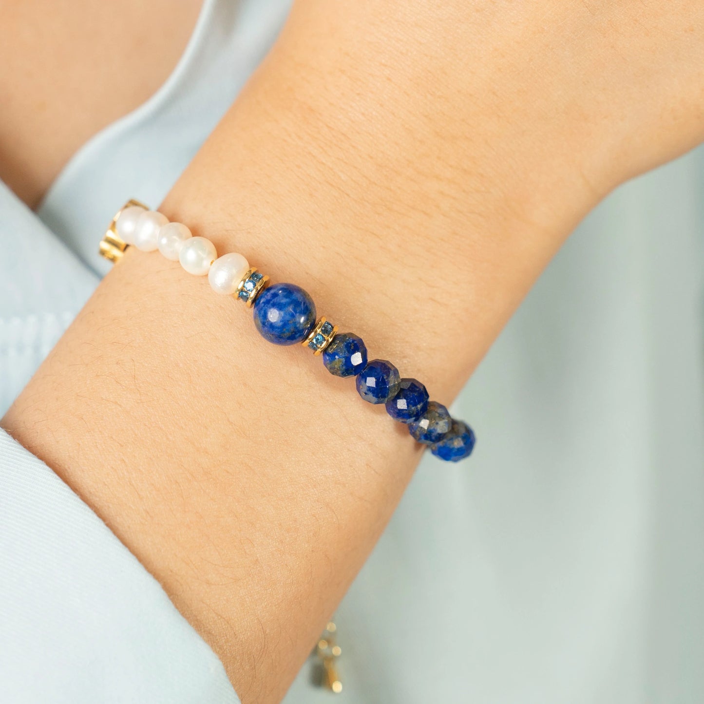 A thoughtful individual, empowered by the Mulstio Lapis and Pearl bracelet to communicate their ideas with authenticity, wisdom, and conviction.