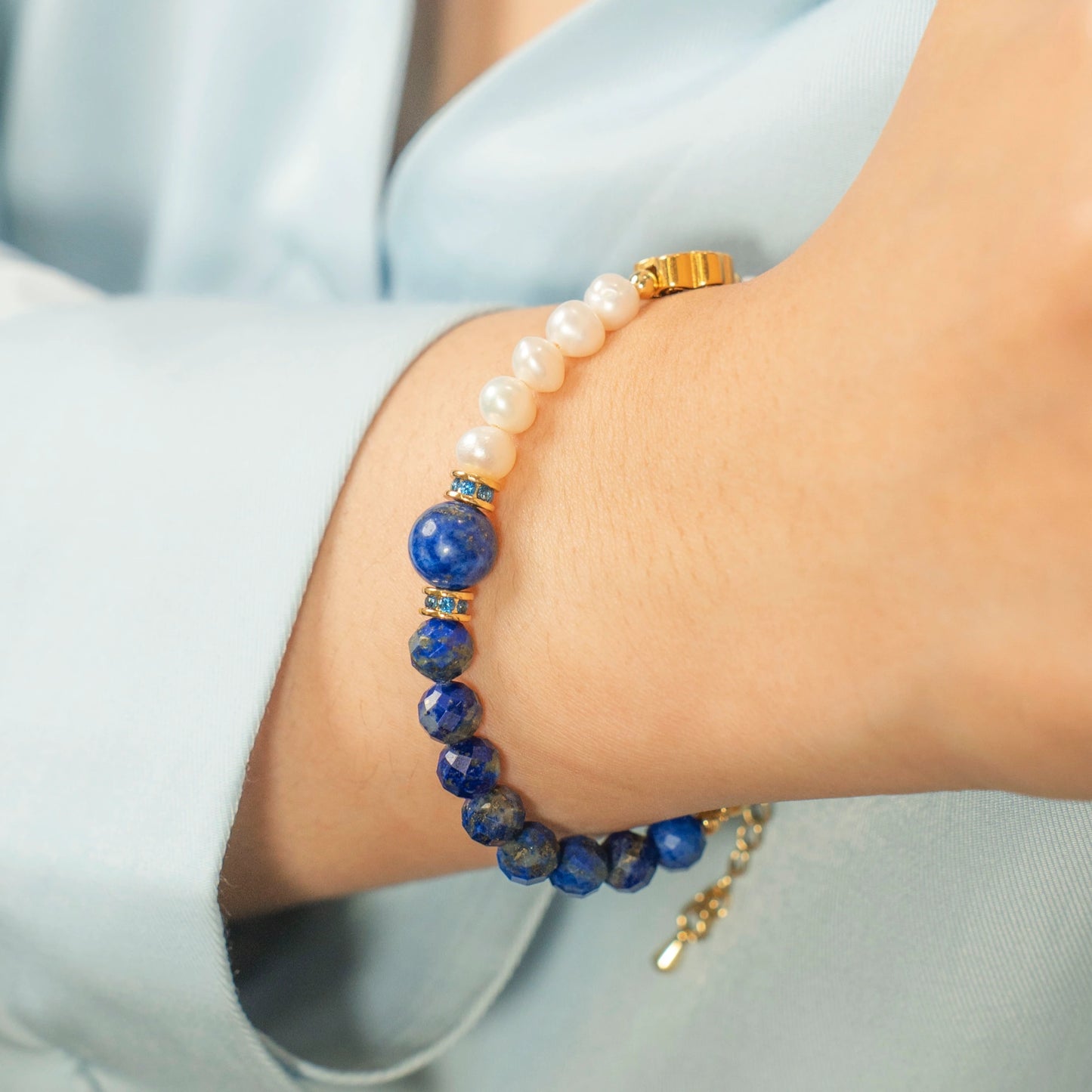 Embrace the power of your authentic voice. Discover the Mulstio September Birthstone Bracelet, a masterful blend of Lapis Lazuli's truth and Pearl's wisdom.
