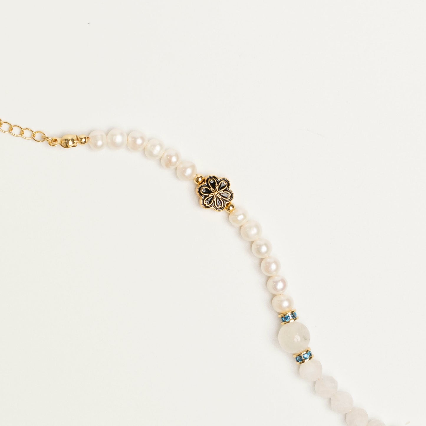 Celebrate the Divine Feminine. This bracelet channels Moonstone's intuitive power and Pearl's nurturing grace, honoring the cyclical nature and wisdom of women.