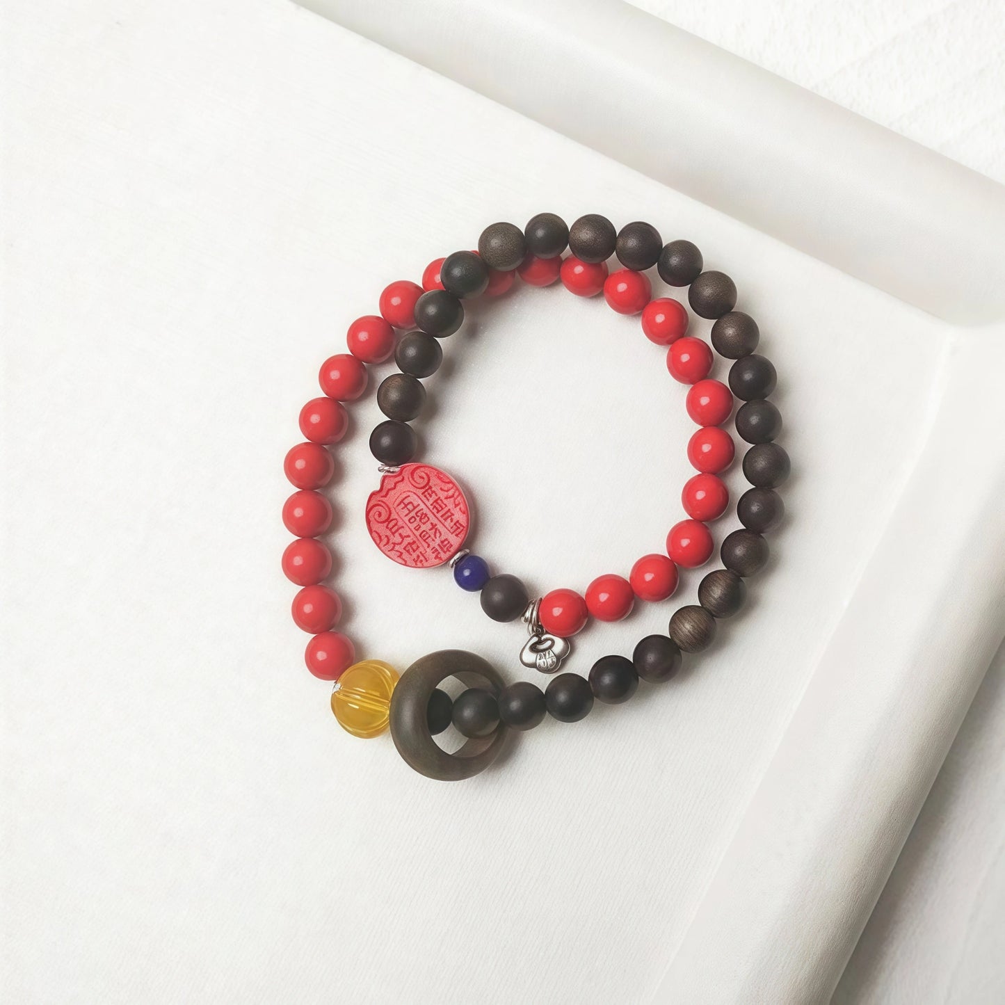 Detail of the vibrant red Cinnabar beads in the double-wrap abundance bracelet.