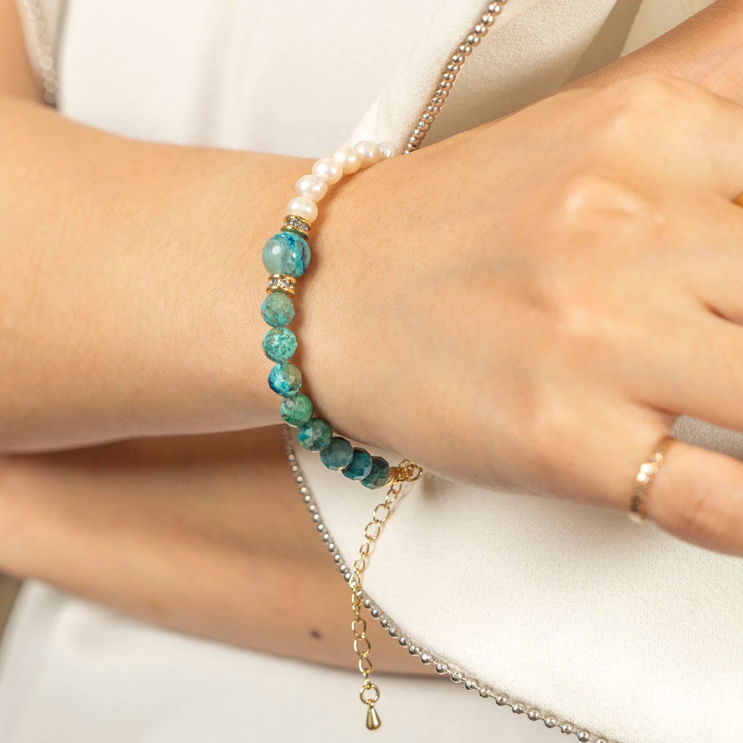 The adjustable December birthstone bracelet shown on a wrist for scale.