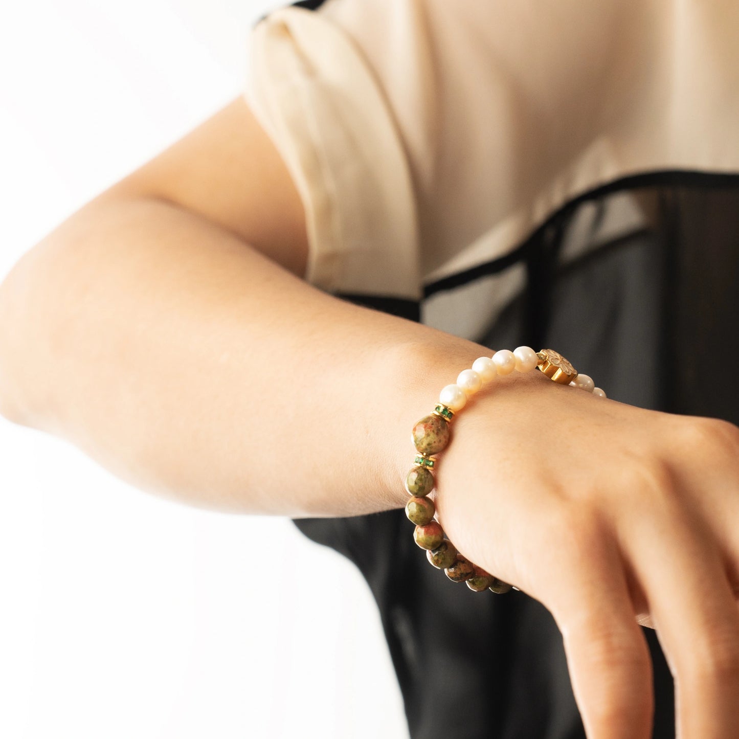 A unique and meaningful May birthday gift. This bracelet features the classic Pearl with Unakite, a powerful yet gentle stone for emotional well-being.