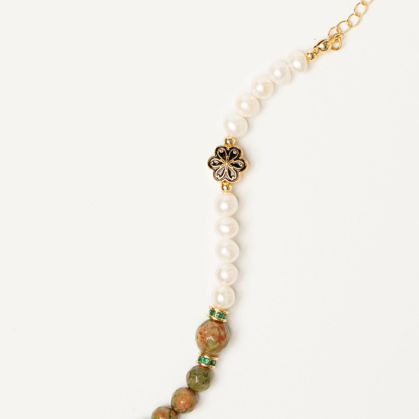 Wearable emotional support for May birthdays. This Mulstio bracelet combines the balancing power of Unakite with the nurturing vibe of Pearl for constant comfort.