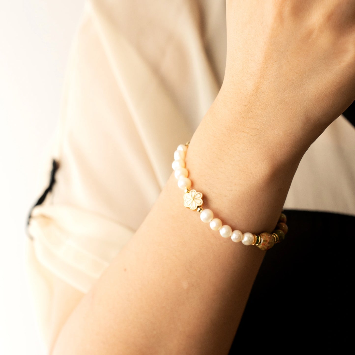 Discover a unique approach to May birthdays. The Mulstio Unakite and Pearl Bracelet offers a beautiful path to emotional balance and gentle nurturing.