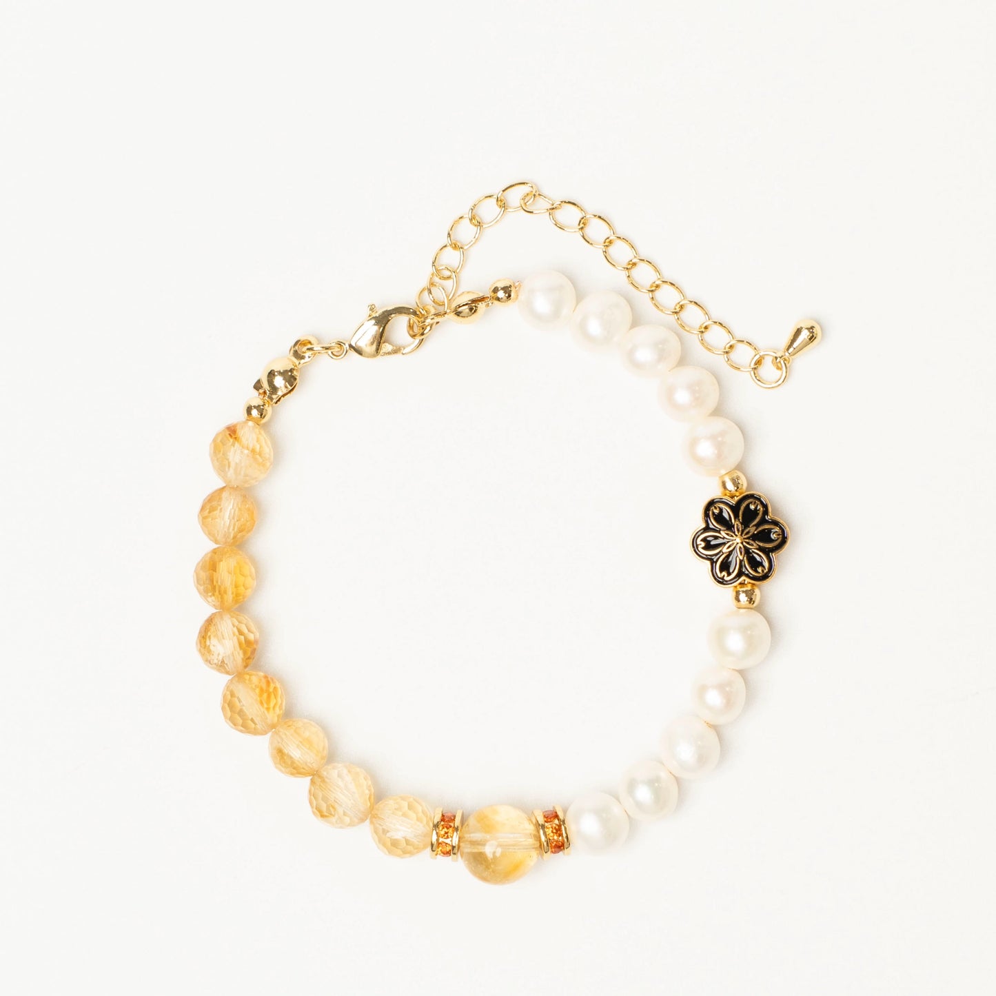 A talisman for manifesting success. This Mulstio bracelet uses Citrine's sunny energy to attract opportunities and Pearl's calming vibe to ensure you navigate them with wisdom and poise.