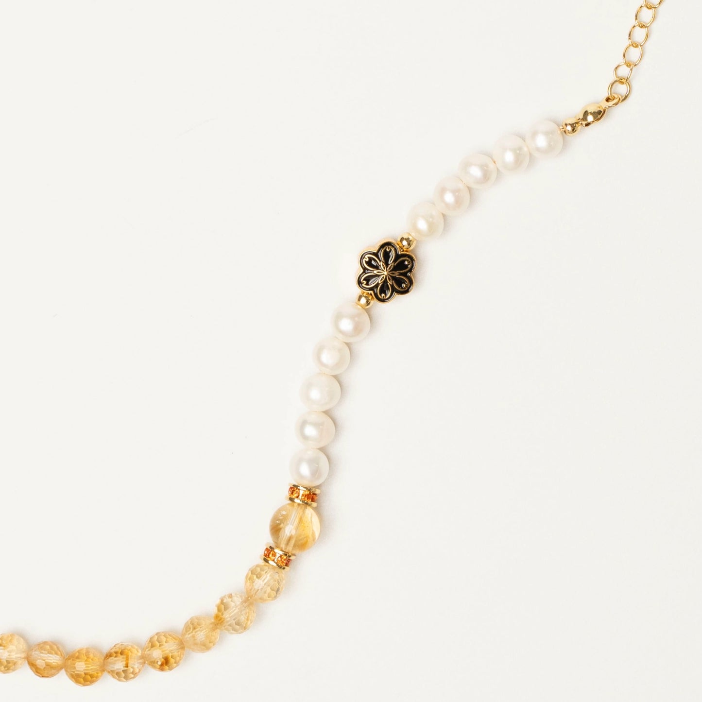 For the ambitious and wise. Wear this Mulstio design with Citrine to boost confidence and attract wealth, while Pearl helps you lead with compassion and integrity.
