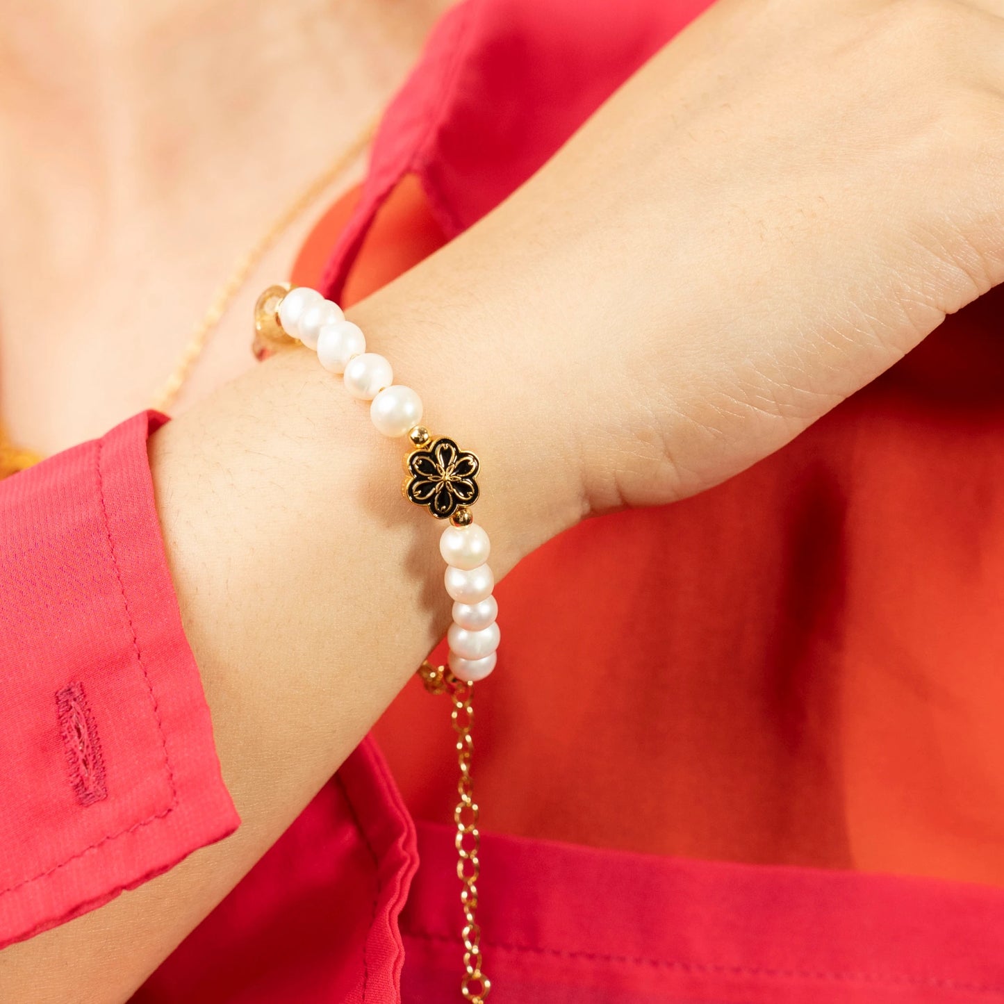 A confident individual achieving their goals, wearing the Mulstio Citrine and Pearl bracelet as a symbol of their balanced approach to success and well-being.