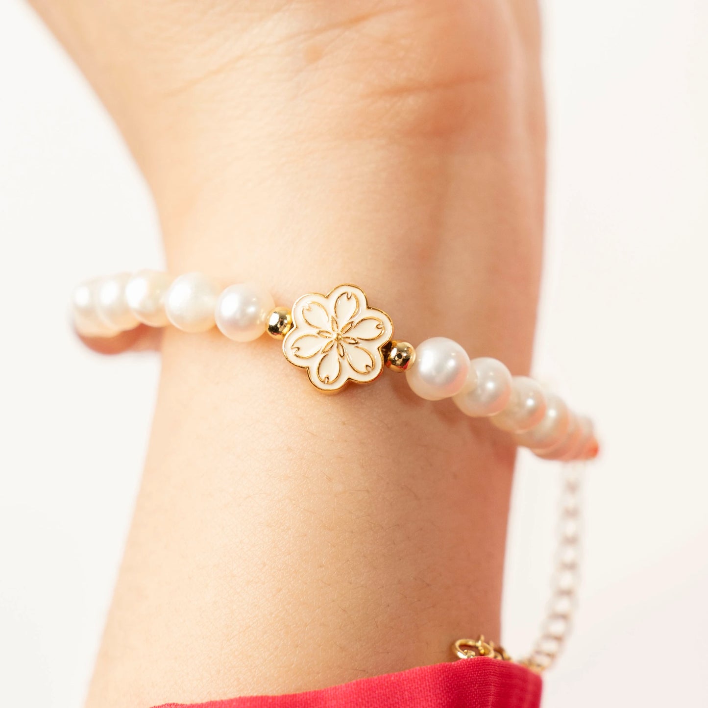 A burst of happy energy for an October birthday. This Mulstio bracelet is a thoughtful gift that combines the joyful vibe of Strawberry Quartz with the classic beauty of Pearl.