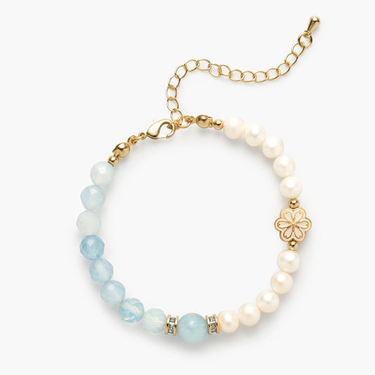 The Mulstio March Birthstone Bracelet, featuring a unique spliced design that alternates serene Aquamarine and luminous Pearl beads for a cascade of calming energy.