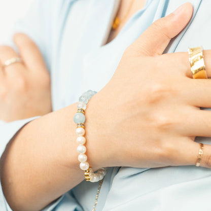 Discover the unique March Birthstone Bracelet from Mulstio. This spliced design of Aquamarine and Pearl is a sophisticated source of serene, protective energy.