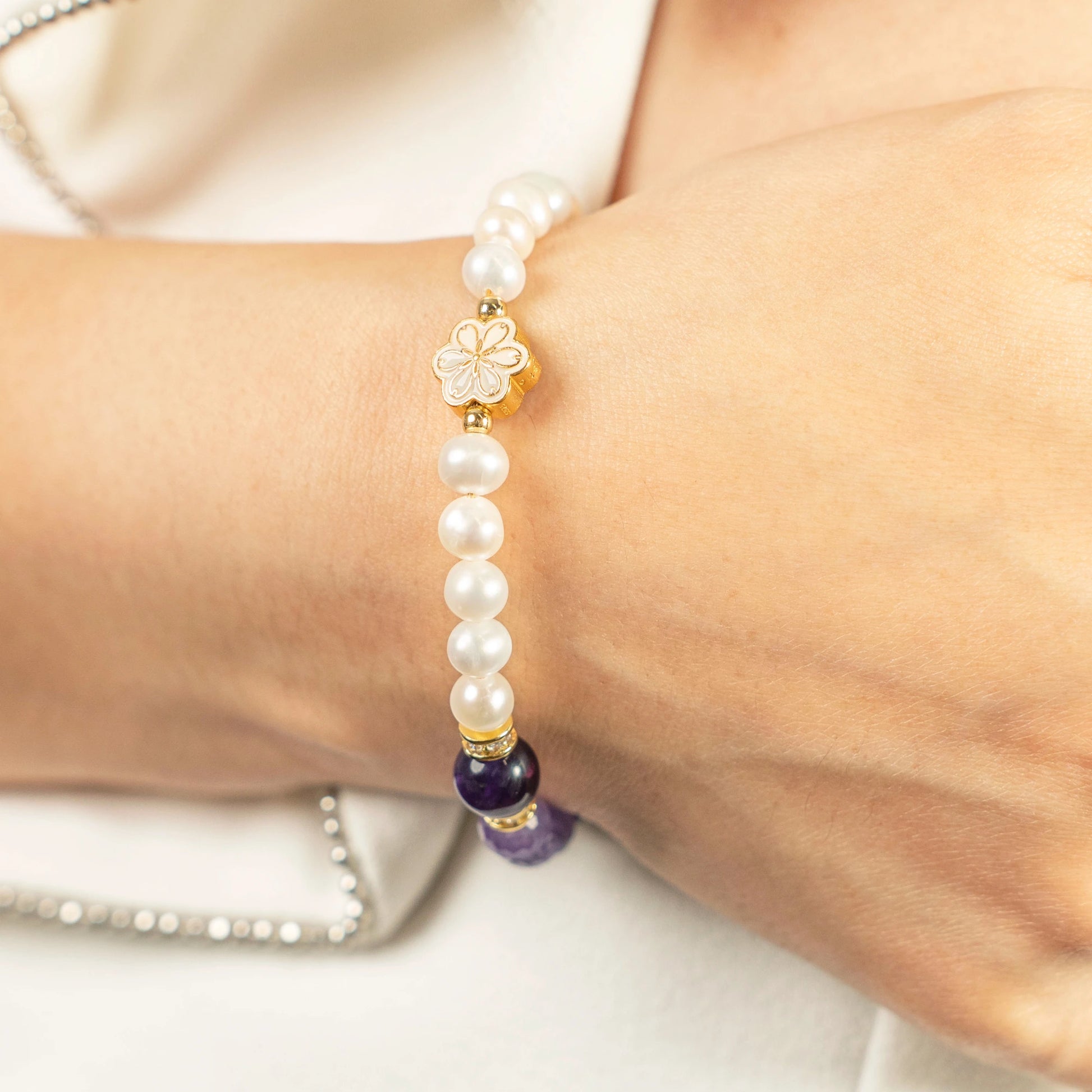 The perfect February birthday gift: A Mulstio bracelet combining the February birthstones, Amethyst for clarity and Pearl for purity, presented in an elegant gift box.