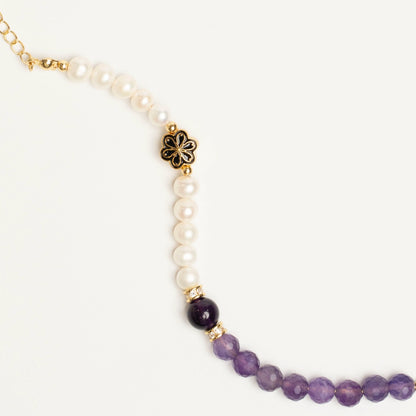 A powerful energy bracelet for February borns, blending Amethyst's calming protection with Pearl's soothing wisdom to balance the wearer's aura.