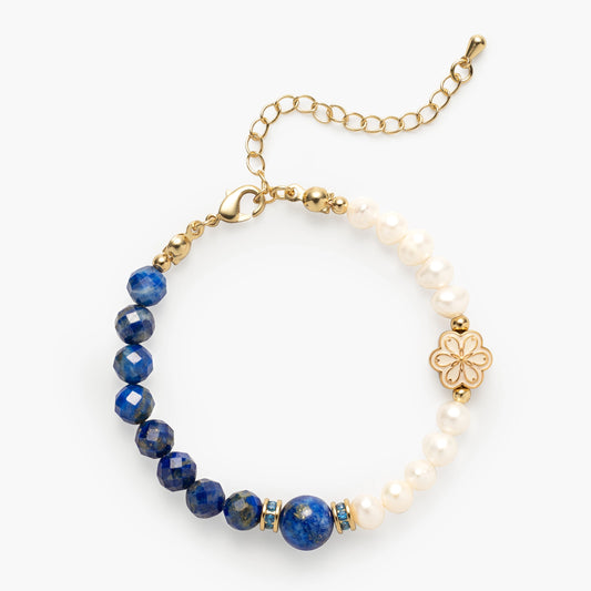The September Birthstone Bracelet by Mulstio, featuring a spliced design of deep blue Lapis Lazuli for universal truth and luminous Pearl for personal wisdom, a union of cosmic and inner knowing.