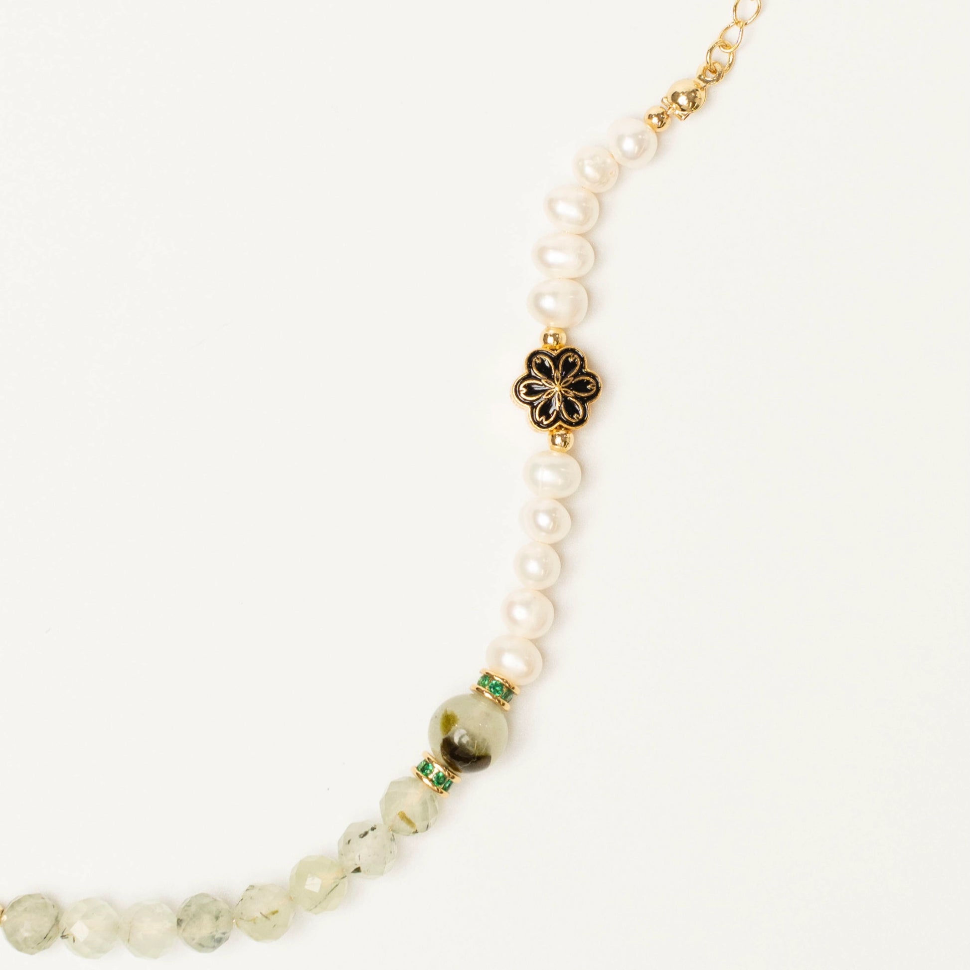 An essential tool for your meditation practice. Wear this Mulstio bracelet to quiet the mind with Prehnite and access deeper states of intuitive knowing with Pearl.