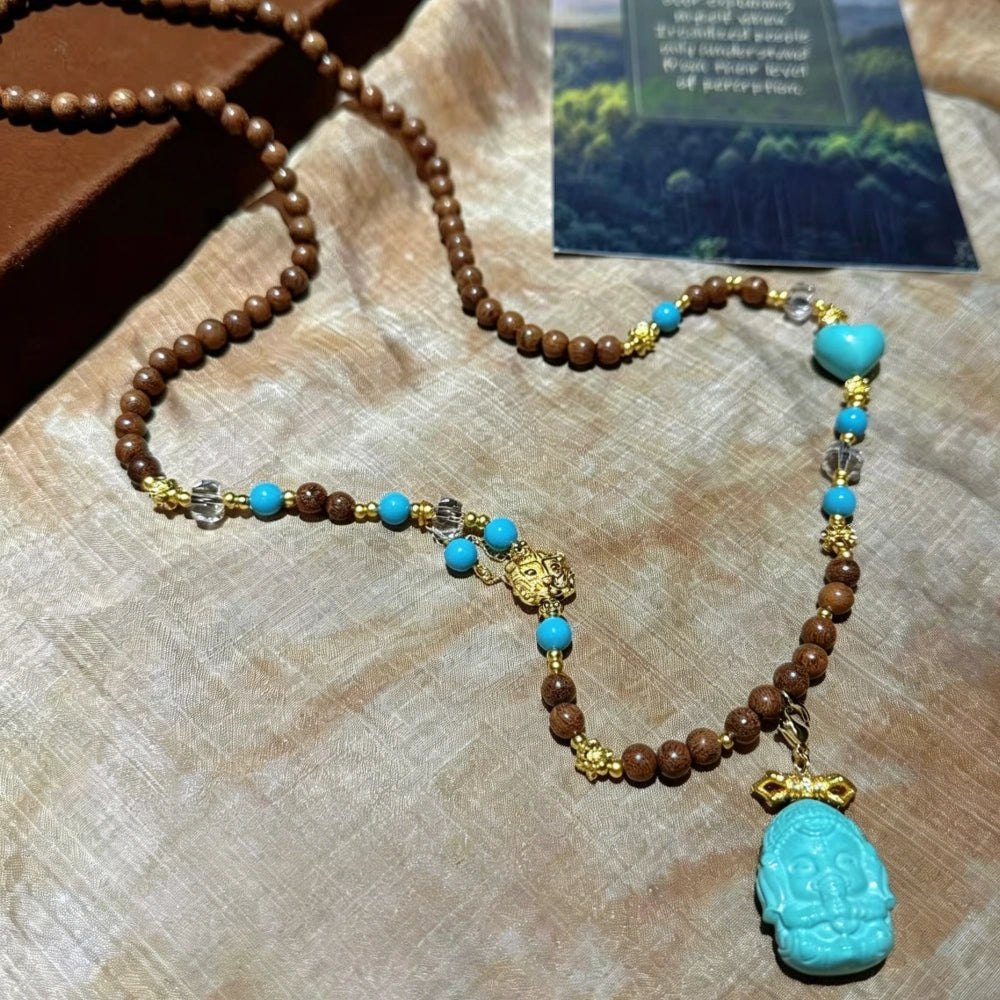 Mulstio Lord Ganesha Magnesite Turquoise and Sandalwood Empowerment Necklace for Inner Peace
