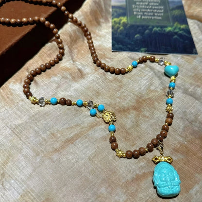 Mulstio Lord Ganesha Magnesite Turquoise and Sandalwood Empowerment Necklace for Inner Peace