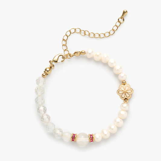The April Birthstone Bracelet by Mulstio, a harmonious blend of vibrant Blue Topaz for vitality and luminous Pearl for wisdom, creating a balanced energy flow.