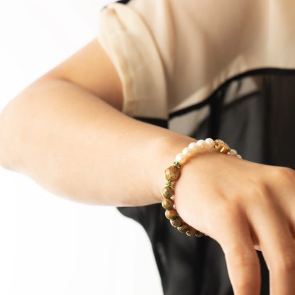 A unique and meaningful May birthday gift. This bracelet features the classic Pearl with Unakite, a powerful yet gentle stone for emotional well-being.
