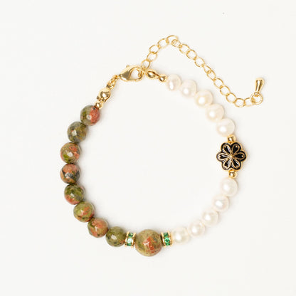 A talisman for caregivers and empaths. This Mulstio bracelet uses Unakite to balance the heart and Pearl to nurture the spirit, preventing emotional exhaustion.
