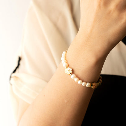 Discover a unique approach to May birthdays. The Mulstio Unakite and Pearl Bracelet offers a beautiful path to emotional balance and gentle nurturing.