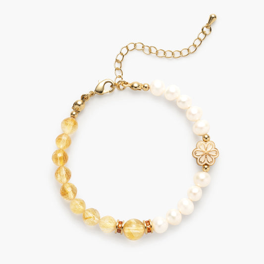 The November Birthstone Bracelet by Mulstio, featuring a spliced design of wealth-attracting Citrine and wisdom-giving Pearl, for a life of abundance and graceful insight.